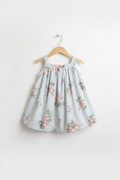 Handmade blue stripe pink rose floral toddler dress on white studio background