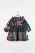 Handmade mauve plaid long sleeve toddler dress with ruffle shoulders on white studio background
