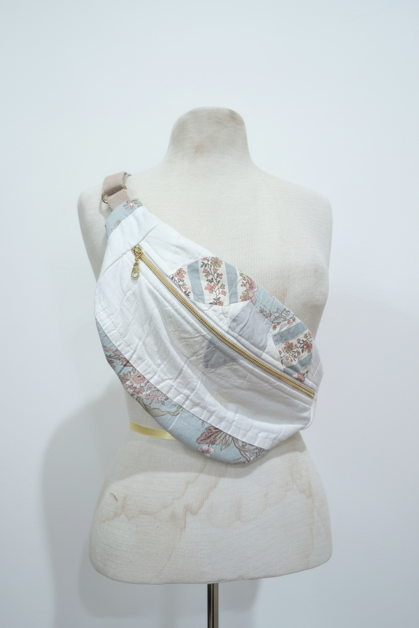White and blue floral crossbody on dress form - studio background